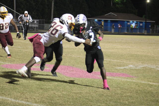 131873067_web1_IMG_1831 
			
				                                Scots wide receiver Samier Pate(12) powers through a Lumberton defender during Friday nights game.
                                 Travis Petty Jr | The Laurinburg Exchange