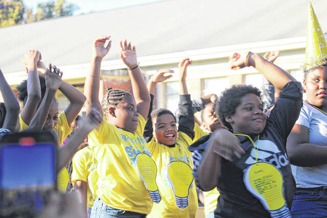 Students at Partners In Ministry shine during the annual <em data-start="716" data-end="739">Lights On Afterschool</em> celebration in Laurinburg.
                                 Tomeka Sinclair | The Laurinburg Exchange