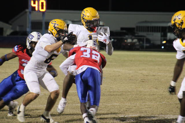 131894021_web1_IMG_1938
Freshman defensive back Jordan McLean (32) brings down a Cape Fear ball carrier during Friday nights game.
Travis Petty Jr | The Laurinburg Exchange