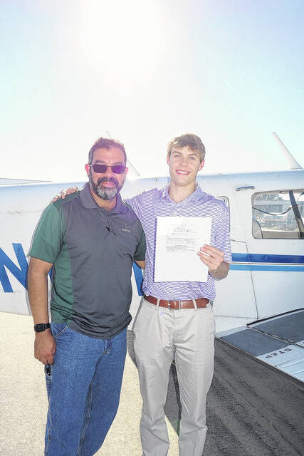 <p>Sam Baker Jr. is shown with flight instructor Hector Valleortiz.</p>
<p>Courtesy photo</p>