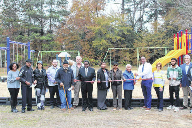 <p>Leaders from Scotland County and the Town of Wagram gather to celebrate the installation of new playground equipment funded through a state rural development grant.</p>
<p>Tomeka Sinclair | The Laurinburg Exchange</p>