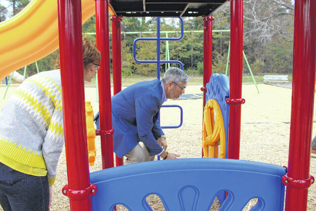 <p>Leaders from Scotland County and the Town of Wagram gather to celebrate the installation of new playground equipment funded through a state rural development grant.</p>
<p>Tomeka Sinclair | The Laurinburg Exchange</p>