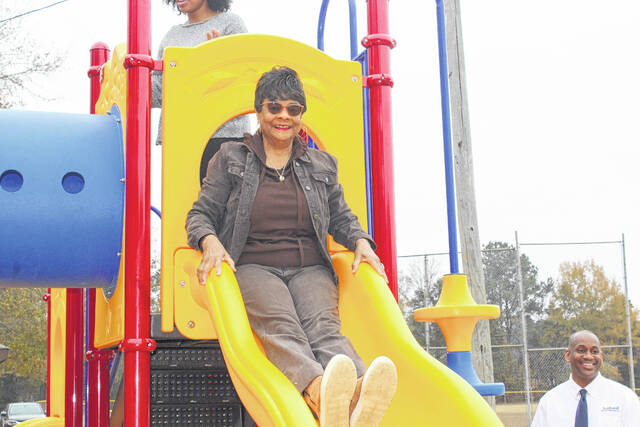 <p>Leaders from Scotland County and the Town of Wagram gather to celebrate the installation of new playground equipment funded through a state rural development grant.</p>
<p>Tomeka Sinclair | The Laurinburg Exchange</p>