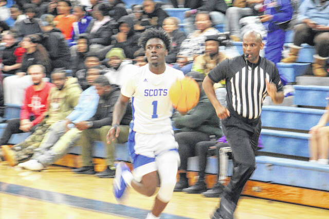 131972484_web1_IMG_2674
Senior guard Zaymon Gibson (1) handles the ball for Scotland High against St.Pauls on Dec. 2, 2025; he scored 21 points in the win.
Travis Petty Jr | The Laurinburg Exchange