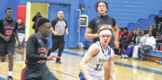 
			
				                                Sophomore guard Maddox McNickle (12) drives in transition as a Cheraw defender guards him on Jan. 3, 2026. 
                                 Travis Petty Jr | The Laurinburg Exchange

			
		