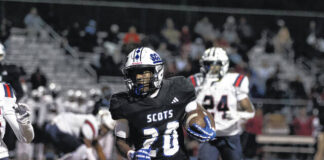 
			
				                                Freshman running back Michael McLean (20) sprints down the sideline against Terry Sanford at Pate Stadium on Nov. 14, 2025. The freshman recently received a Division I scholarship from Georgia State University.
                                 Courtesy Photo

			
		