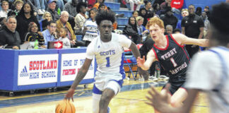 
			
				                                Scots senior Zaymon Gibson (1) drives past a Terry Sanford defender during Fridays game.
                                 Travis Petty Jr | The Laurinburg Exchange

			
		