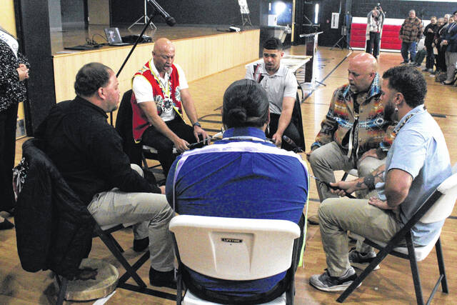 132076456_web1_lead-IMG_0383
Lumbee Tribal Chairman John Lowery, second from right, and the Dark Water Society play an honor song at a ceremony recognizing the anniversary of the Battle of Hayes Pond Friday in Pembroke.
Chris Stiles | The Robesonian