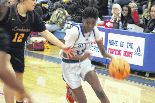 <p>Scots freshman Amaria Bostick (3) maneuvers past a Lumberton defender on Jan. 23, 2026. </p>
<p>Travis Petty Jr | The Laurinburg Exchange</p>