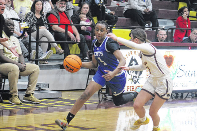 Scots senior Jakiya Brown (4) works past a Lumberton defender on Feb. 10, 2026. 
                                 Travis Petty Jr | The Laurinburg Exchange