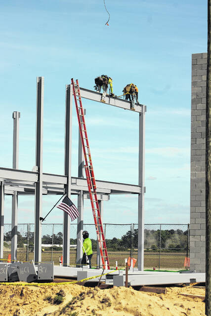 Attendees gather Thursday at Laurinburg-Maxton Airport as officials mark a construction milestone for the airports new 8,200-square-foot terminal during a ceremony highlighting ongoing progress on the $5.2 million project. The event featured remarks from local, state and federal leaders and the placement of a structural steel beam in the new buildings framework.
Tomeka Sinclair | The Laurinburg Exchange