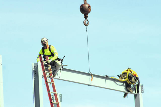 A steel beam is lifted into place Thursday during construction of the new terminal at Laurinburg-Maxton Airport. Officials marked the moment as a key milestone in the project.
Tomeka Sinclair | The Laurinburg Exchange