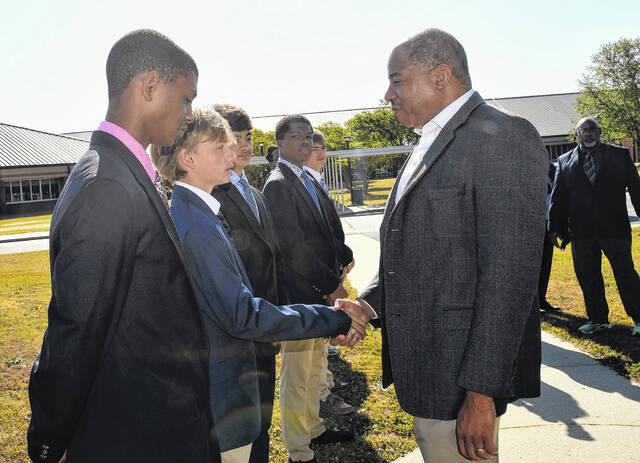 State Superintendent Mo Green greets students during a tour of Carver Middle School on Monday as part of a statewide education initiative visit.
                                 Courtesy photo | Scotland County Schools