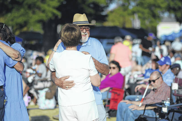 Attendees dance to live music during Laurinburg After Five at the Suds and Swine festival in downtown Laurinburg.
                                 Katelin Gandee | The Laurinburg Exchange
