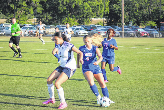 Scotland junior Brianna Quick (4) controls the ball as a Purnell Swett defender applies pressure on April 22, 2026.
                                 Travis Petty Jr | The Laurinburg Exchange