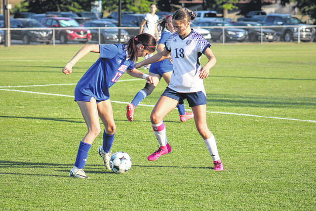 Scotland freshman Elizabeth Chavis (17) dribbles the soccer ball while being defended on April 22, 2026.
                                 Travis Petty Jr | The Laurinburg Exchange