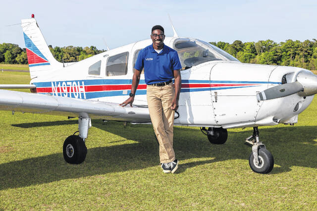 Air Force ROTC Cadet Maximus Lang stands in front of a Piper Warrior II at Fayetteville Regional Airport, where he is training as part of his pursuit to become an Air Force pilot.
                                 Courtesy photo | Via UNCP