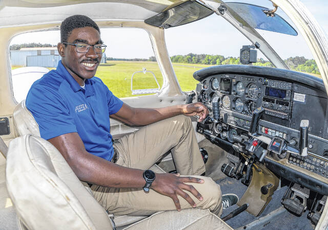Air Force ROTC Cadet Maximus Lang stands in front of a Piper Warrior II at Fayetteville Regional Airport, where he is training as part of his pursuit to become an Air Force pilot.
                                 Courtesy photo | Via UNCP
