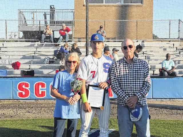 Scotland seniors Kaden Hunsucker, Dawson Williams and Blaine Callahan poses with family after being recognized for Senior Night on April 27, 2026.
                                 Travis Petty Jr | The Laurinburg Exchange
