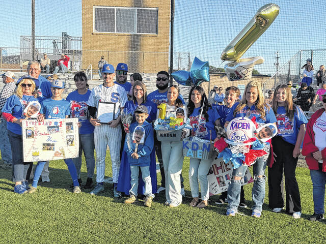Scotland seniors Kaden Hunsucker, Dawson Williams and Blaine Callahan poses with family after being recognized for Senior Night on April 27, 2026.
                                 Travis Petty Jr | The Laurinburg Exchange