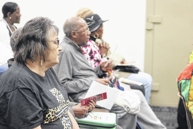 Residents, clergy and local officials gather inside the Scotland County Courthouse for the National Day of Prayer after rain forced the annual observance indoors.
                                 Tomeka Sinclair | The Laurinburg Exchange