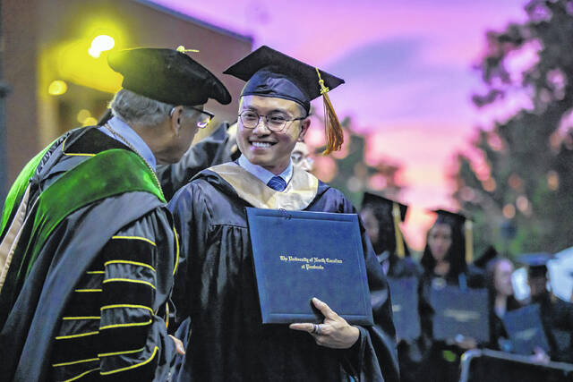 Students take part in Spring Commencement exercises at the University of North Carolina at Pembroke, where 1,173 graduates were honored across undergraduate and graduate programs. Former NASA astronaut and keynote speaker Dr. John Herrington encouraged graduates to embrace resilience, adaptability and purpose as they enter the next chapter of their lives.
                                 Courtesy photo | UNCP