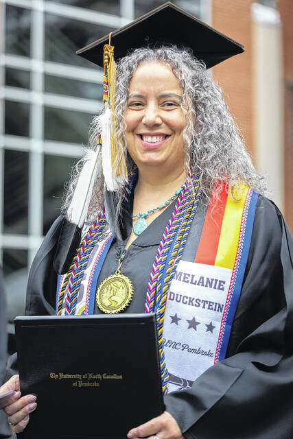 Students take part in Spring Commencement exercises at the University of North Carolina at Pembroke, where 1,173 graduates were honored across undergraduate and graduate programs. Former NASA astronaut and keynote speaker Dr. John Herrington encouraged graduates to embrace resilience, adaptability and purpose as they enter the next chapter of their lives.
                                 Courtesy photo | UNCP