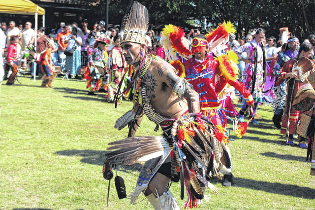 A participant dances at a powwow during the Lumbee Tribes Federal Recognition Celebration Saturday in Pembroke.
                                 Chris Stiles | The Robesonian