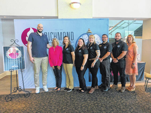 Bill Frenchs grandson, Tyler French, and his sister, Mary Crofton, stand with North Carolina NENA members at the ceremony establishing a scholarship in Frenchs honor.
Courtesy photo | RichmondCC