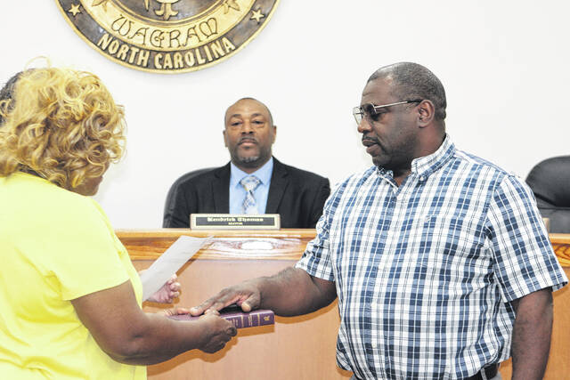 Commissioner Kenneth Farmer is sworn in as mayor pro tempore of Wagram during a special meeting Friday.
Tomeka Sinclair | The Laurinburg Exchange